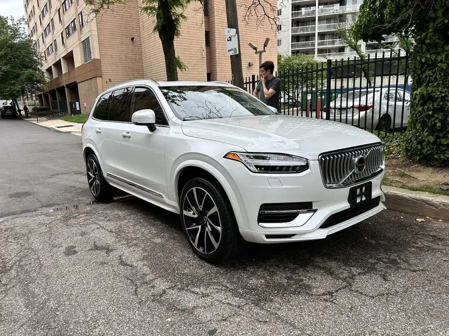 White Volvo XC90 at a city curb after an exterior detail